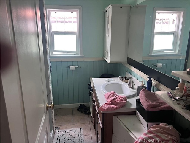 702 N Burris Ave, Compton, CA 90221 - bathroom with a wainscoted wall, vanity, tile patterned floors, and wooden walls
