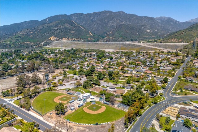 aerial view of property's location with a mountainous background