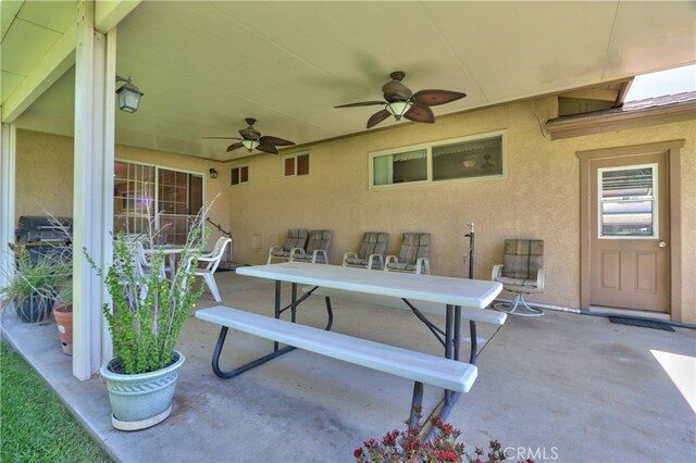 view of patio featuring outdoor dining area and ceiling fan