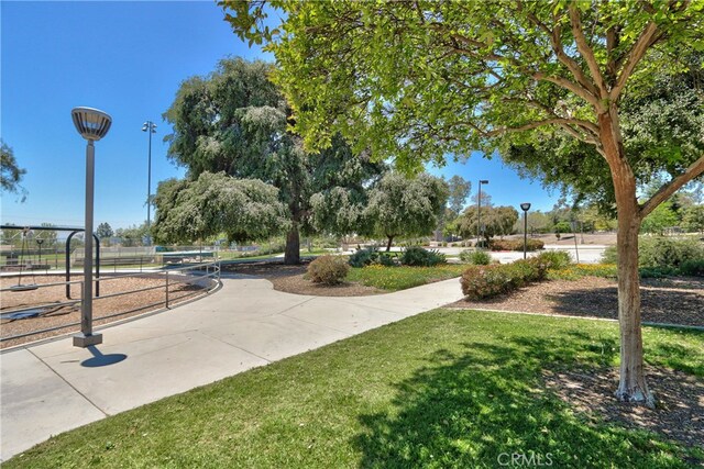 view of home's community with a yard