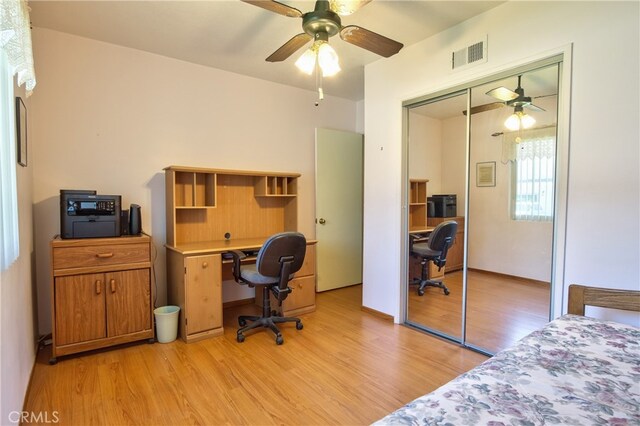 office space featuring ceiling fan and light wood finished floors