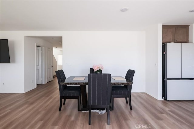 959 Rockcress Ln, Banning, CA 92220 - dining room with light wood-style flooring and baseboards