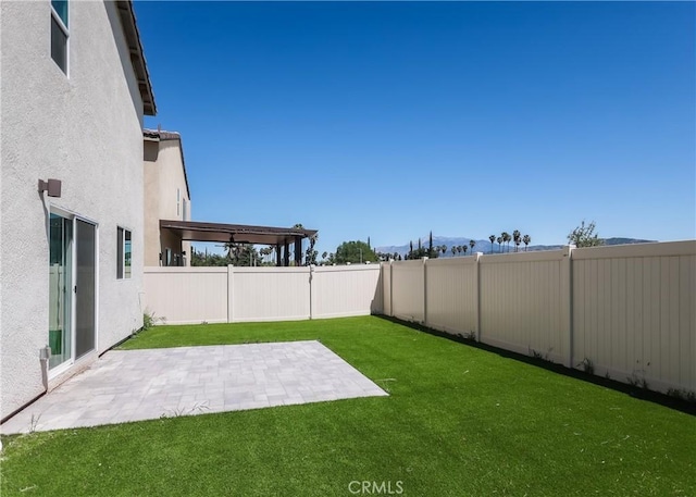 959 Rockcress Ln, Banning, CA 92220 - view of yard featuring a patio area and a mountain view