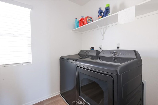 959 Rockcress Ln, Banning, CA 92220 - laundry room featuring washing machine and dryer, wood finished floors, and baseboards