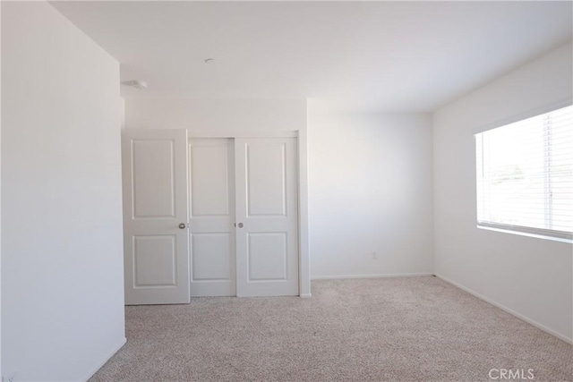 959 Rockcress Ln, Banning, CA 92220 - unfurnished bedroom with carpet floors, a closet, and baseboards