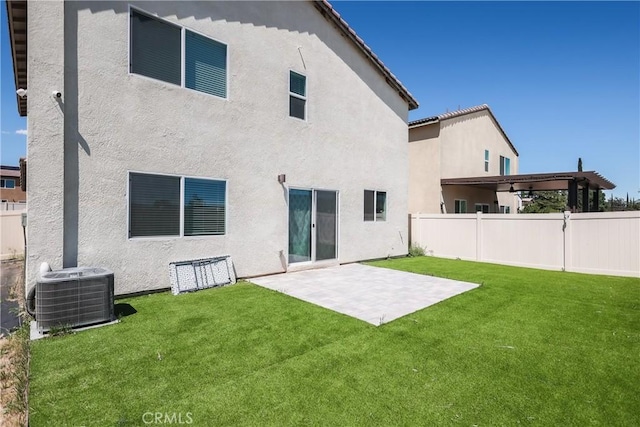 959 Rockcress Ln, Banning, CA 92220 - back of property with central AC unit, stucco siding, and a patio
