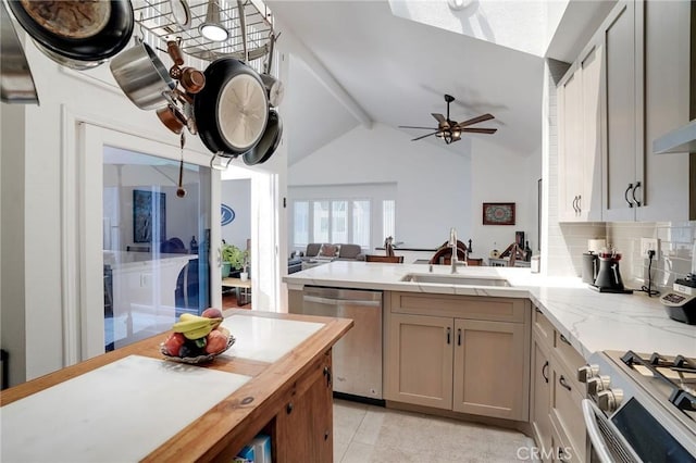 25552 Paseo La Vis Unit 20, Laguna Niguel, CA 92677 - kitchen with stainless steel appliances, a sink, a peninsula, ceiling fan, and open floor plan