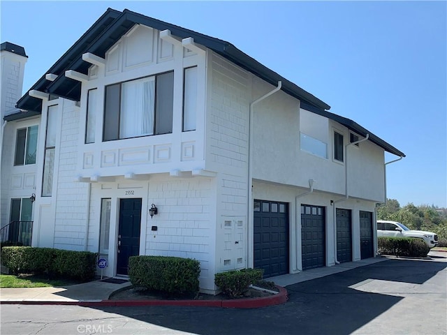 25552 Paseo La Vis Unit 20, Laguna Niguel, CA 92677 - view of property with a garage and driveway