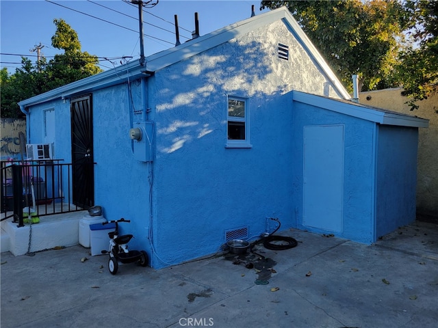 2112 E Lucien St, Compton, CA 90222 - rear view of property with stucco siding and a patio