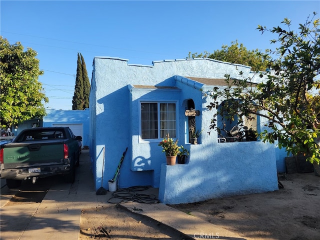 2112 E Lucien St, Compton, CA 90222 - mediterranean / spanish-style house with stucco siding and concrete driveway