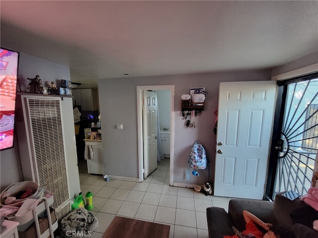 2112 E Lucien St, Compton, CA 90222 - foyer entrance featuring a heating unit, light tile patterned floors, and baseboards