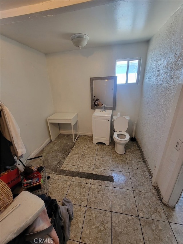 2112 E Lucien St, Compton, CA 90222 - bathroom with toilet, a sink, and baseboards