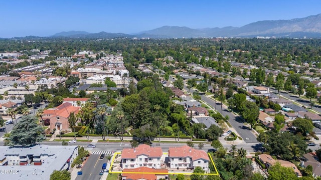 300 E Alhambra Rd Unit D, Alhambra, CA 91801 - aerial view of property and surrounding area featuring a mountainous background, nearby suburban area, and property boundaries highlighted