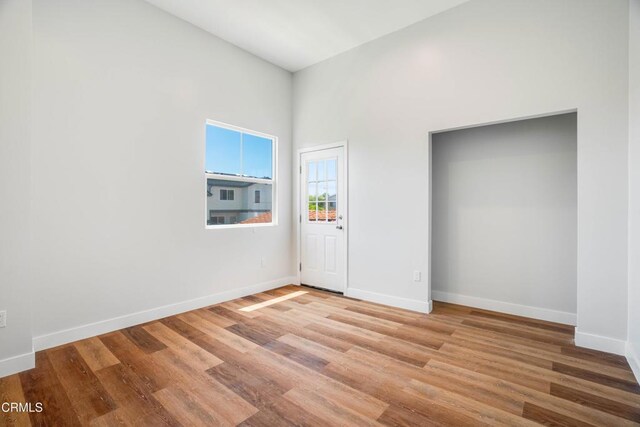 300 E Alhambra Rd Unit D, Alhambra, CA 91801 - unfurnished bedroom featuring wood finished floors and a towering ceiling