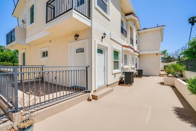 300 E Alhambra Rd Unit D, Alhambra, CA 91801 - doorway to property featuring stucco siding, a balcony, and a patio area