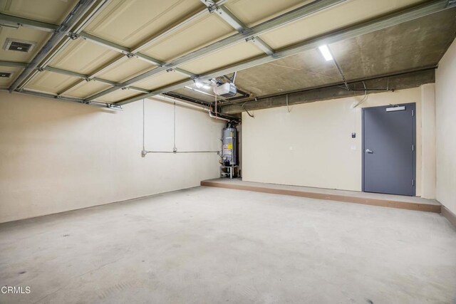 300 E Alhambra Rd Unit D, Alhambra, CA 91801 - garage featuring secured water heater and a garage door opener