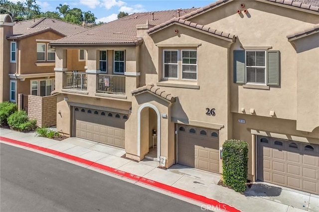 28116 Calle Lumina, Temecula, CA 92592 - view of front facade with a garage, stucco siding, a tiled roof, and a balcony