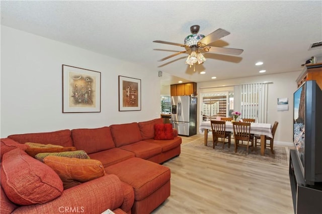 7030 Idyllwild Ln, Riverside, CA 92503 - living area with a ceiling fan, light wood-style floors, and recessed lighting