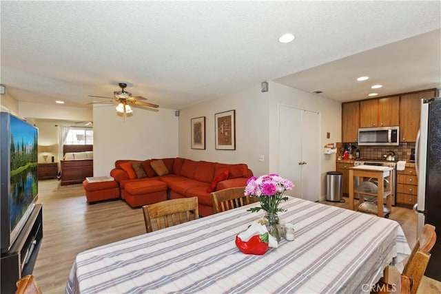 7030 Idyllwild Ln, Riverside, CA 92503 - dining area featuring light wood-style flooring, recessed lighting, ceiling fan, and a textured ceiling