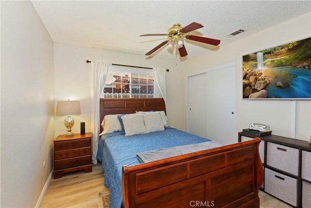 7030 Idyllwild Ln, Riverside, CA 92503 - bedroom with light wood-style flooring, baseboards, a closet, and a ceiling fan