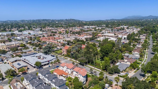 aerial view of property and surrounding area with a mountainous background