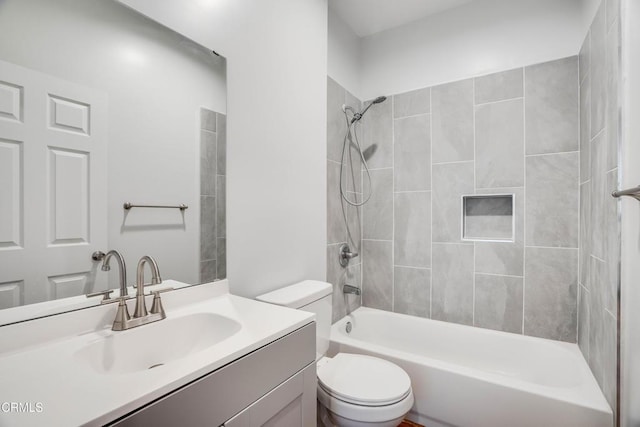 bathroom with toilet, vanity, and  shower combination