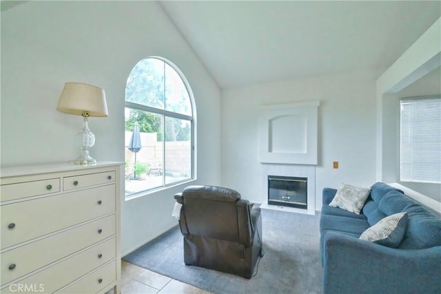 1778 Rockview Way, Pomona, CA 91766 - living room with vaulted ceiling, a fireplace with flush hearth, light tile patterned flooring, and baseboards