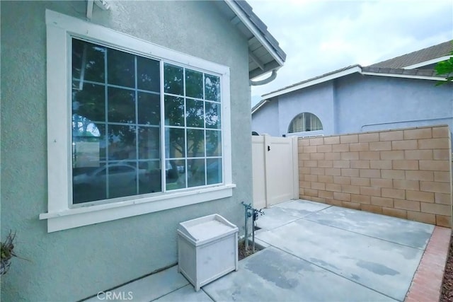 1778 Rockview Way, Pomona, CA 91766 - view of side of property with stucco siding and a patio area