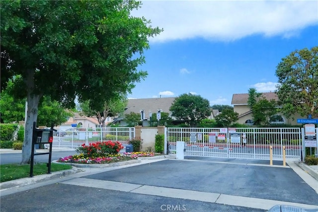 1778 Rockview Way, Pomona, CA 91766 - view of asphalt street with curbs, a gated entry, and a gate