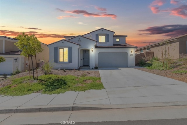25367 Circle Stone Dr, Menifee, CA 92586 - mediterranean / spanish-style home with stucco siding, a tile roof, concrete driveway, and an attached garage