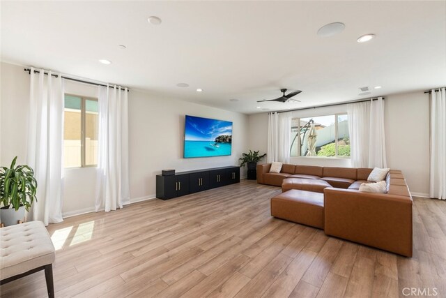 25367 Circle Stone Dr, Menifee, CA 92586 - living room with light wood-style flooring, recessed lighting, a ceiling fan, and baseboards