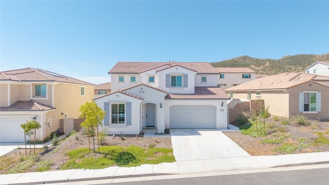 25367 Circle Stone Dr, Menifee, CA 92586 - mediterranean / spanish-style home featuring stucco siding, driveway, a tile roof, an attached garage, and a mountain view
