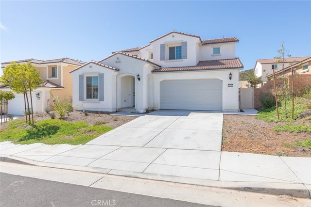 25367 Circle Stone Dr, Menifee, CA 92586 - mediterranean / spanish home with a tile roof, concrete driveway, stucco siding, an attached garage, and fence
