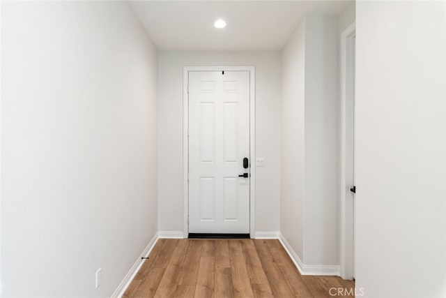 25367 Circle Stone Dr, Menifee, CA 92586 - doorway to outside featuring light wood-style floors, recessed lighting, and baseboards