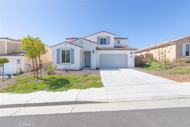 25367 Circle Stone Dr, Menifee, CA 92586 - mediterranean / spanish-style home featuring concrete driveway, stucco siding, a tiled roof, and an attached garage