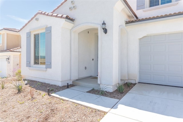 25367 Circle Stone Dr, Menifee, CA 92586 - property entrance with a tiled roof and stucco siding