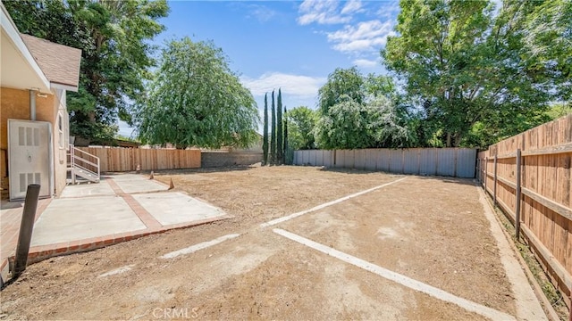 fenced backyard featuring a patio