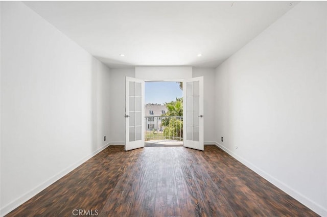 unfurnished room with french doors, baseboards, wood finished floors, and recessed lighting