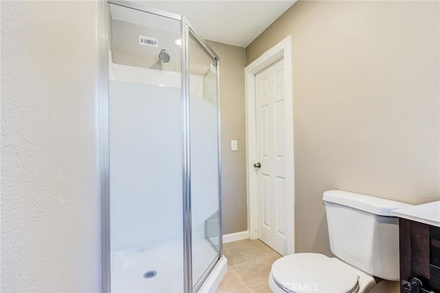 33350 Robin Dr, Green Valley Lake, CA 92341 - bathroom featuring a shower stall, toilet, tile patterned flooring, and vanity