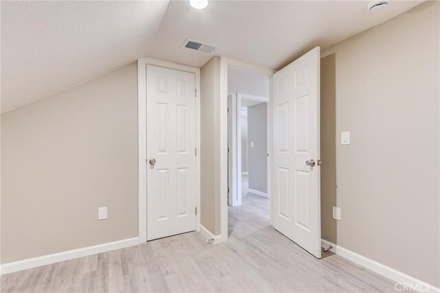 33350 Robin Dr, Green Valley Lake, CA 92341 - additional living space featuring light wood-type flooring, baseboards, and vaulted ceiling