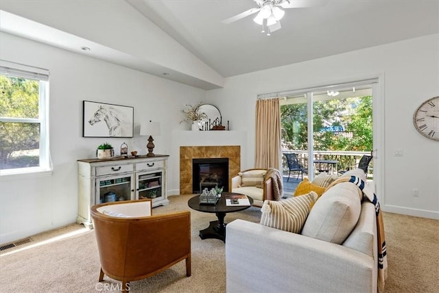 511 3rd St, Paso Robles, CA 93446 - carpeted living area featuring vaulted ceiling, a tiled fireplace, ceiling fan, and baseboards