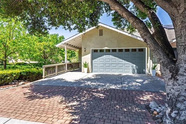 511 3rd St, Paso Robles, CA 93446 - view of front facade featuring stucco siding, driveway, and a garage