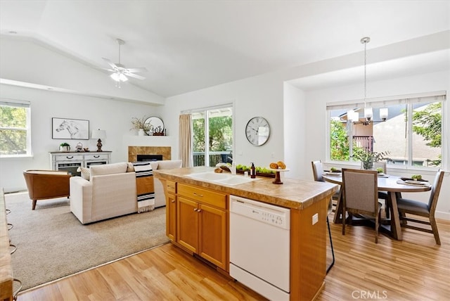 511 3rd St, Paso Robles, CA 93446 - kitchen with dishwasher, a sink, a fireplace, light wood-style floors, and lofted ceiling