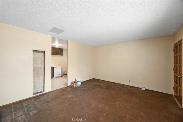 spare room featuring a textured ceiling