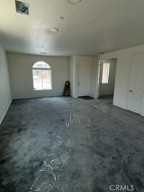 unfurnished living room with healthy amount of natural light