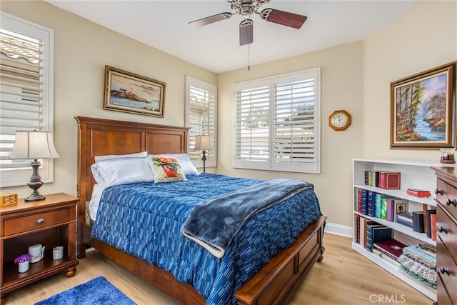 684 Big Spring Dr, Banning, CA 92220 - bedroom with light wood-style flooring, a ceiling fan, and baseboards