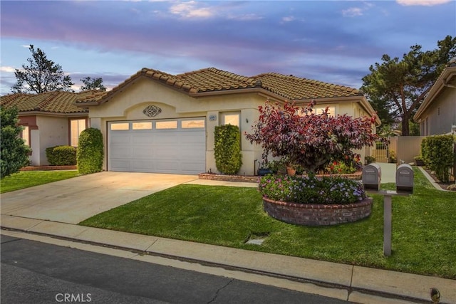 684 Big Spring Dr, Banning, CA 92220 - mediterranean / spanish-style home featuring an attached garage, stucco siding, driveway, and a tiled roof