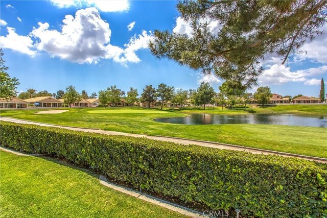684 Big Spring Dr, Banning, CA 92220 - view of home's community with a water view, a lawn, and a residential view
