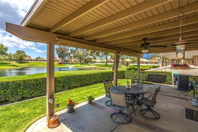 684 Big Spring Dr, Banning, CA 92220 - view of patio / terrace with a water view, outdoor dining space, and a ceiling fan