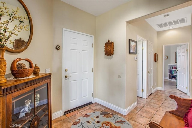 684 Big Spring Dr, Banning, CA 92220 - foyer entrance with light tile patterned floors and baseboards